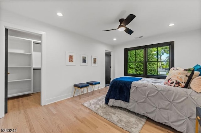10 Wilson Ave, Wayne Twp, NJ 07470 - bedroom with a spacious closet, light wood-style flooring, recessed lighting, baseboards, and ceiling fan
