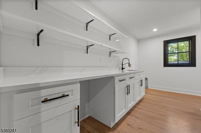 10 Wilson Ave, Wayne Twp, NJ 07470 - bar area featuring a sink, light wood-type flooring, baseboards, and recessed lighting