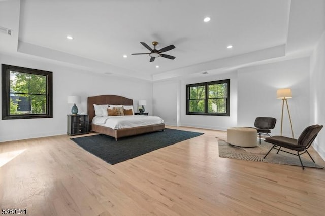 10 Wilson Ave, Wayne Twp, NJ 07470 - bedroom featuring a tray ceiling, wood finished floors, multiple windows, and recessed lighting