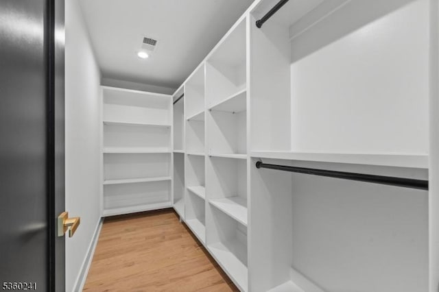 10 Wilson Ave, Wayne Twp, NJ 07470 - walk in closet featuring light wood-type flooring