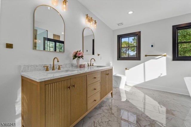 10 Wilson Ave, Wayne Twp, NJ 07470 - full bath featuring a soaking tub, double vanity, lofted ceiling, marble finish flooring, and recessed lighting