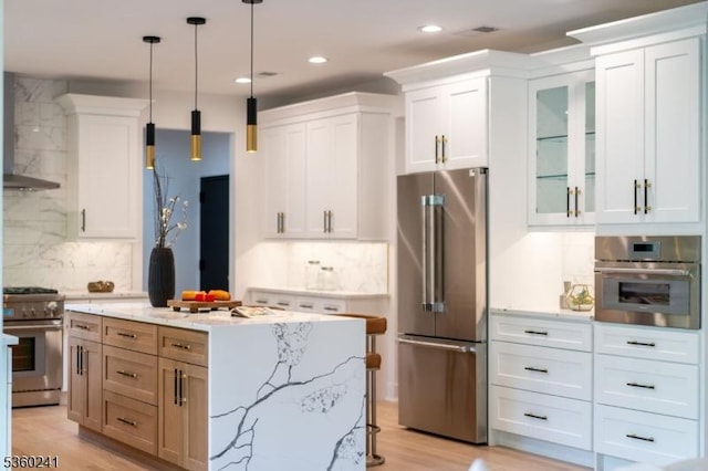 10 Wilson Ave, Wayne Twp, NJ 07470 - kitchen with premium appliances, backsplash, white cabinets, glass insert cabinets, and decorative light fixtures