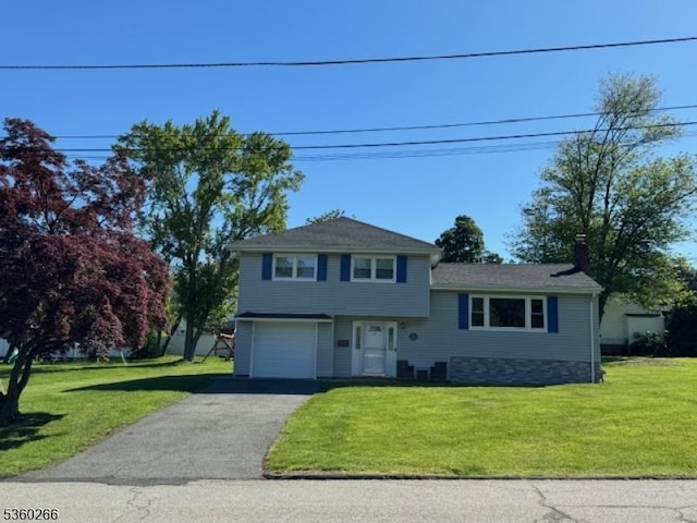 74 Knickerbocker Ave, Randolph Twp, NJ 07869 - split level home featuring an attached garage, a front lawn, asphalt driveway, and a chimney