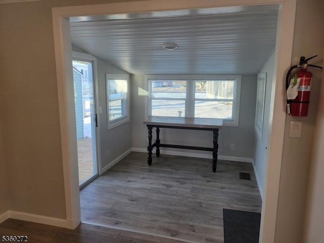 131 Douglas Dr, Jackson Twp, NJ 08527 - unfurnished dining area featuring lofted ceiling, baseboards, and wood finished floors