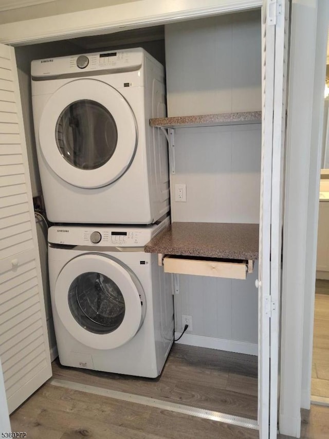 131 Douglas Dr, Jackson Twp, NJ 08527 - laundry area featuring stacked washer and clothes dryer and wood finished floors