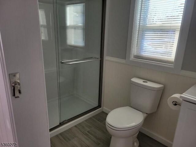 131 Douglas Dr, Jackson Twp, NJ 08527 - full bathroom with a shower stall, toilet, plenty of natural light, vanity, and wainscoting