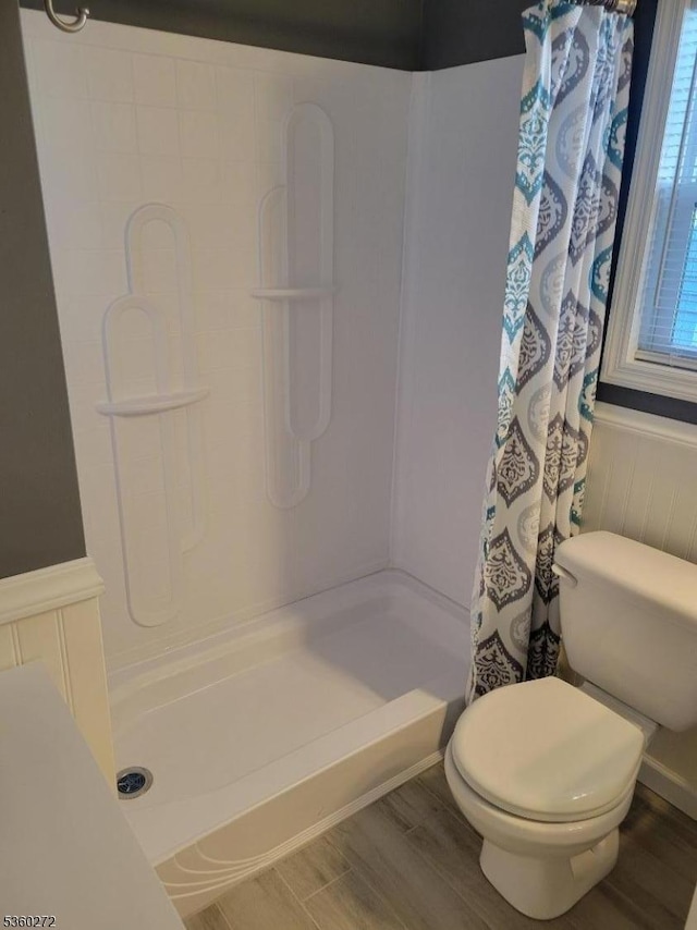 131 Douglas Dr, Jackson Twp, NJ 08527 - bathroom with wainscoting, a shower with curtain, wood finished floors, and toilet