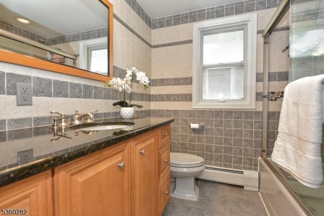 789 Charnwood Dr, Wyckoff Twp, NJ 07481 - bathroom featuring a baseboard heating unit, vanity, tile walls, tile patterned flooring, and plenty of natural light