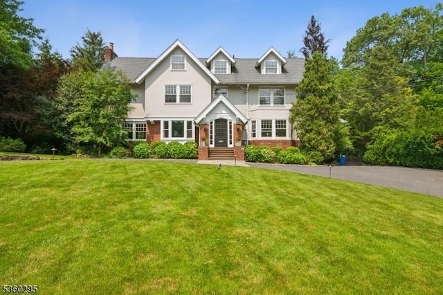 66 Fernwood Rd, Summit City, NJ 07901 - view of front of home with a front lawn, stucco siding, and brick siding