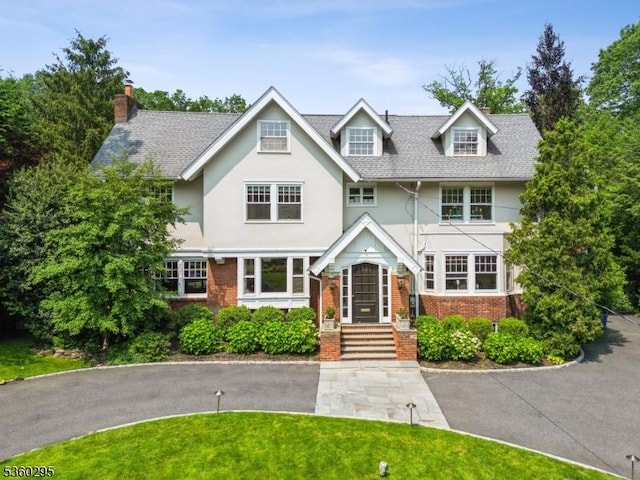 66 Fernwood Rd, Summit City, NJ 07901 - tudor-style house with brick siding, stucco siding, and a front lawn