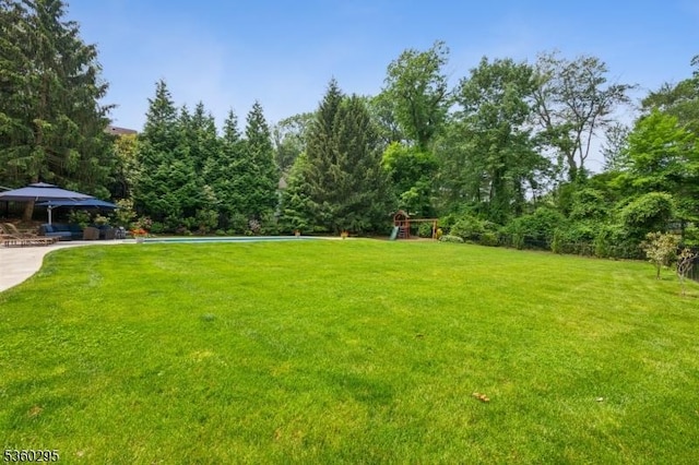 66 Fernwood Rd, Summit City, NJ 07901 - view of grassy yard featuring a playground