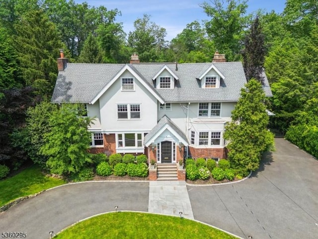 66 Fernwood Rd, Summit City, NJ 07901 - view of front of property with a chimney, brick siding, stucco siding, and driveway
