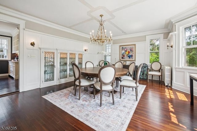 66 Fernwood Rd, Summit City, NJ 07901 - dining space with radiator heating unit, a chandelier, a decorative wall, wood finished floors, and crown molding