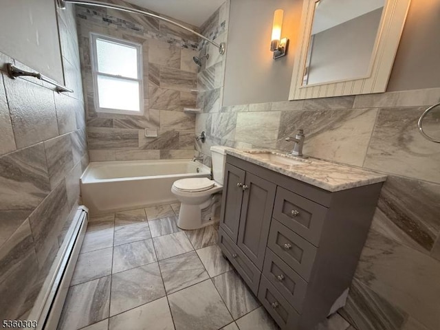 131-33 Netherwood Ave, Plainfield City, NJ 07062 - full bathroom featuring tile walls, baseboard heating, marble finish flooring, vanity, and bathtub / shower combination