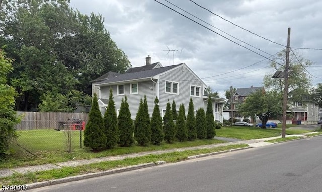 131-33 Netherwood Ave, Plainfield City, NJ 07062 - view of side of home featuring a chimney