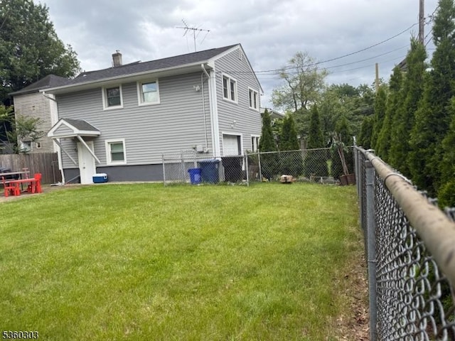 131-33 Netherwood Ave, Plainfield City, NJ 07062 - rear view of property featuring a garage and a chimney