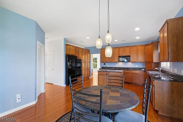 3 Spyglass Hl, Fredon Twp, NJ 07860 - kitchen featuring black appliances, wood finished floors, a sink, baseboards, and brown cabinets