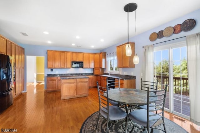 3 Spyglass Hl, Fredon Twp, NJ 07860 - kitchen featuring black appliances, dark countertops, light wood finished floors, a center island, and recessed lighting