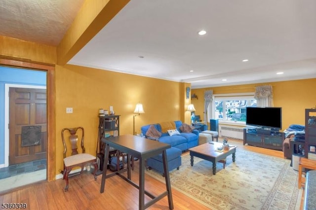 36 William St, West Orange Twp, NJ 07052 - living room with radiator, wood finished floors, and recessed lighting