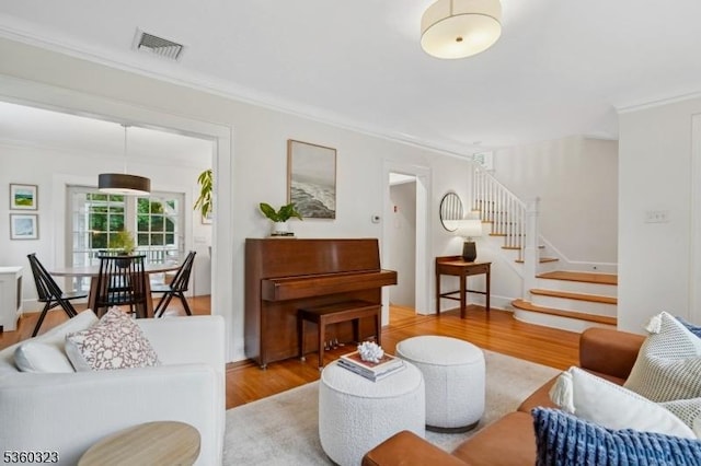 51 S Pierson Rd, Maplewood Twp, NJ 07040 - living area with wood finished floors, ornamental molding, and stairway