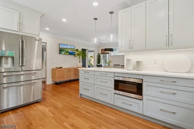 51 S Pierson Rd, Maplewood Twp, NJ 07040 - kitchen featuring stainless steel appliances, light wood-style floors, light countertops, recessed lighting, and hanging light fixtures