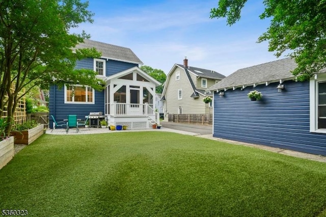 51 S Pierson Rd, Maplewood Twp, NJ 07040 - back of property featuring a shingled roof and a patio