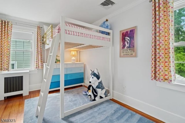 51 S Pierson Rd, Maplewood Twp, NJ 07040 - bedroom featuring wood finished floors, radiator, and ornamental molding