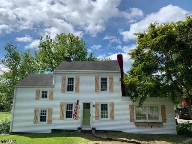 89 Leffler Hill Rd, Raritan Twp, NJ 08822 - view of front of home with a chimney and a front lawn
