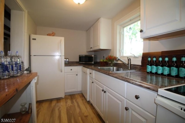 89 Leffler Hill Rd, Raritan Twp, NJ 08822 - kitchen featuring white appliances, white cabinets, light wood-type flooring, and dark stone countertops