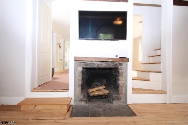 89 Leffler Hill Rd, Raritan Twp, NJ 08822 - detailed view of wood finished floors and a fireplace with flush hearth