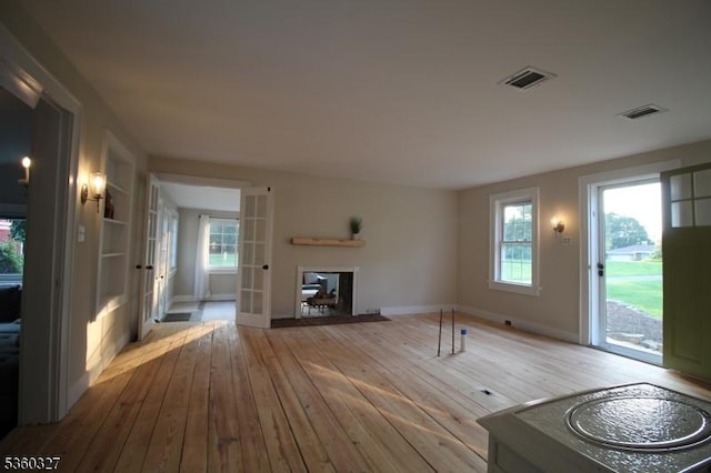 89 Leffler Hill Rd, Raritan Twp, NJ 08822 - unfurnished living room featuring hardwood / wood-style floors and french doors