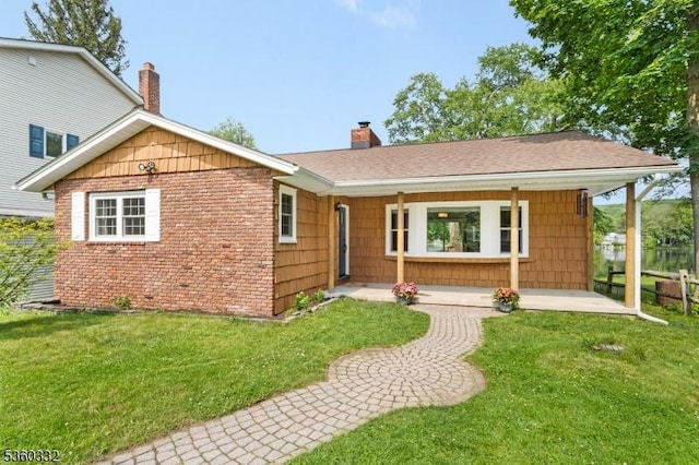 111 Lake Dr, Byram Twp, NJ 07874 - single story home featuring a front lawn, a chimney, a shingled roof, and a porch