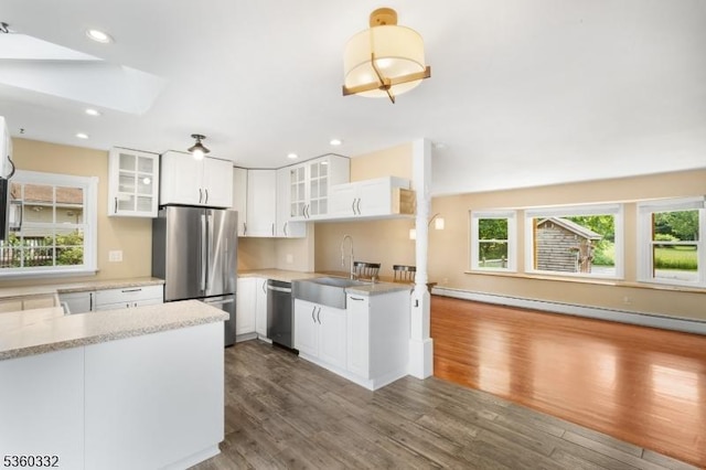 111 Lake Dr, Byram Twp, NJ 07874 - kitchen featuring appliances with stainless steel finishes, baseboard heating, dark wood finished floors, light countertops, and recessed lighting