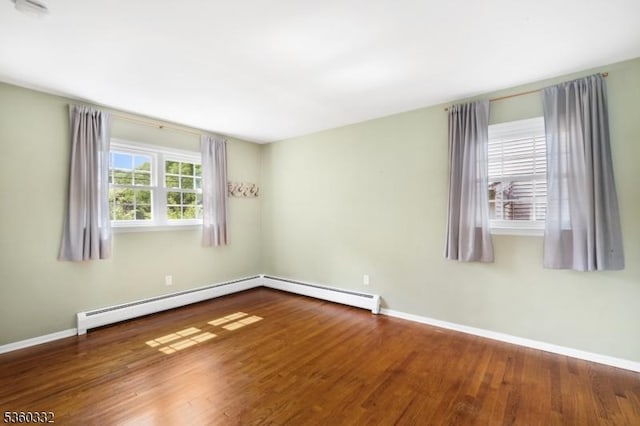 111 Lake Dr, Byram Twp, NJ 07874 - spare room featuring wood finished floors, baseboards, and a baseboard heating unit
