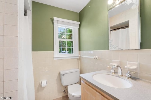 111 Lake Dr, Byram Twp, NJ 07874 - bathroom featuring toilet, tile walls, vanity, a wainscoted wall, and curtained shower