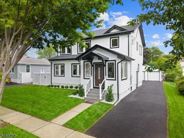 25 Albert Ave, Fair Lawn Boro, NJ 07410 - view of front facade with an outdoor structure, a detached garage, and driveway
