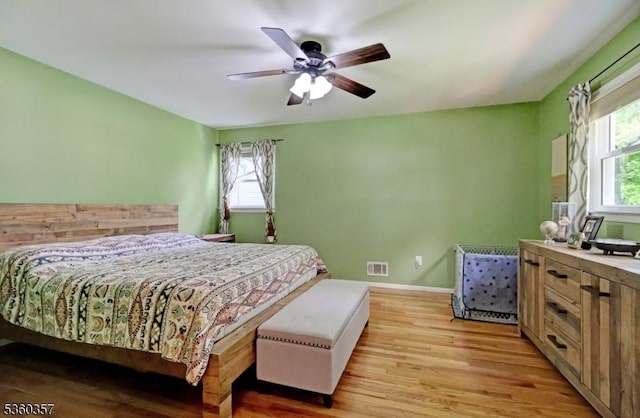 17 Druid Hill Dr, Parsippany-Troy Hills Twp, NJ 07054 - bedroom featuring multiple windows, light wood-type flooring, ceiling fan, and baseboards