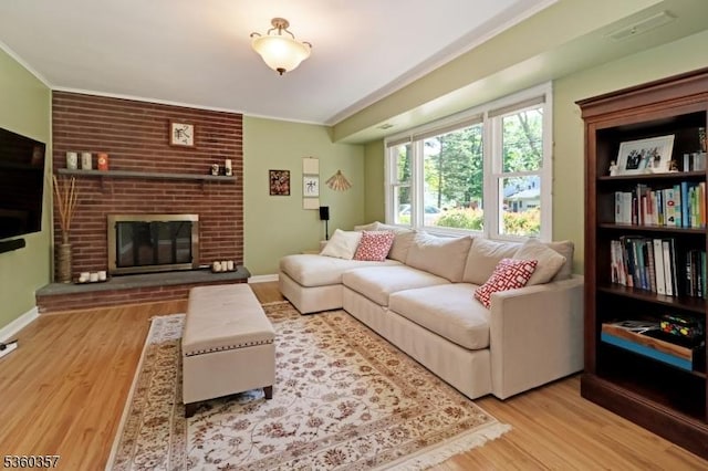 17 Druid Hill Dr, Parsippany-Troy Hills Twp, NJ 07054 - living room featuring wood finished floors, crown molding, a brick fireplace, and baseboards