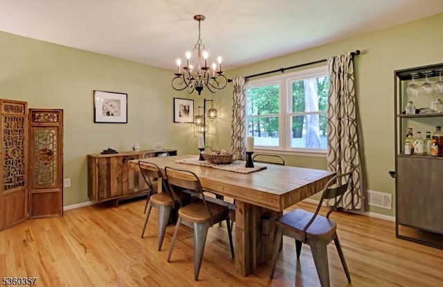 17 Druid Hill Dr, Parsippany-Troy Hills Twp, NJ 07054 - dining space featuring a chandelier, light wood finished floors, and baseboards