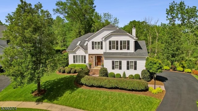 17 Steeple Chase Ct, Bedminster Twp, NJ 07921 - traditional-style house featuring a front lawn, a chimney, and a shingled roof