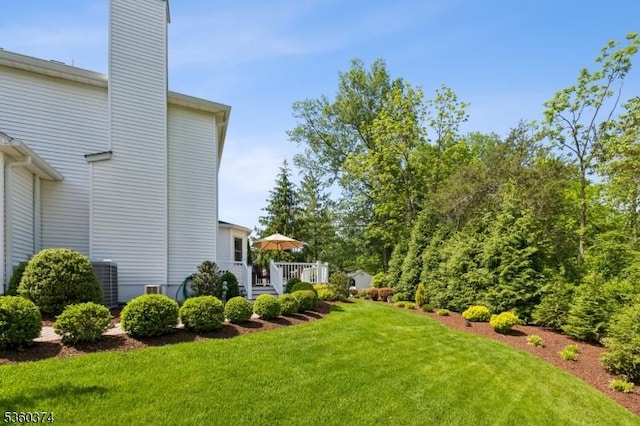 17 Steeple Chase Ct, Bedminster Twp, NJ 07921 - view of green lawn with a deck and central air condition unit