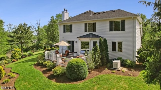17 Steeple Chase Ct, Bedminster Twp, NJ 07921 - rear view of house with a lawn, a chimney, and a wooden deck