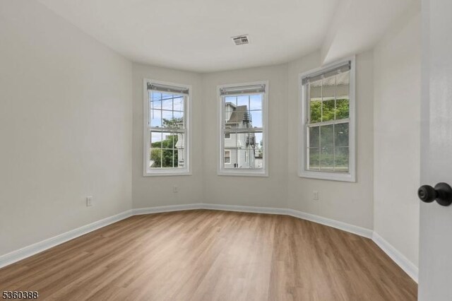 261 22nd St, Irvington Twp, NJ 07111 - empty room featuring light wood-type flooring and baseboards