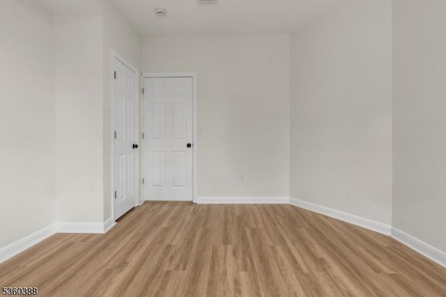 261 22nd St, Irvington Twp, NJ 07111 - empty room featuring light wood-style flooring, baseboards, and a smoke detector