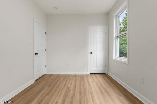 261 22nd St, Irvington Twp, NJ 07111 - unfurnished bedroom with light wood-style flooring and baseboards