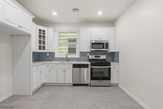 261 22nd St, Irvington Twp, NJ 07111 - kitchen featuring stainless steel appliances, a sink, decorative backsplash, light countertops, and recessed lighting