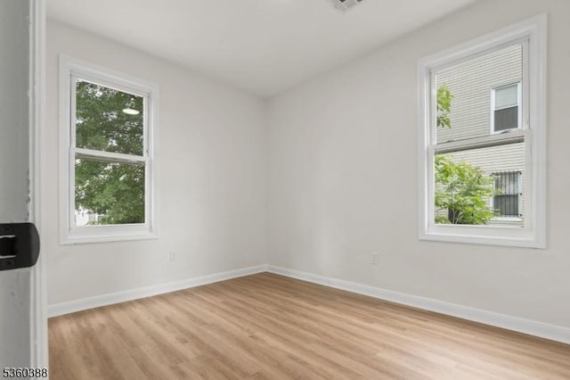 261 22nd St, Irvington Twp, NJ 07111 - spare room featuring light wood finished floors and baseboards