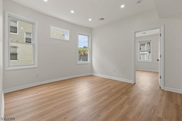 261 22nd St, Irvington Twp, NJ 07111 - empty room with light wood-type flooring, recessed lighting, and baseboards