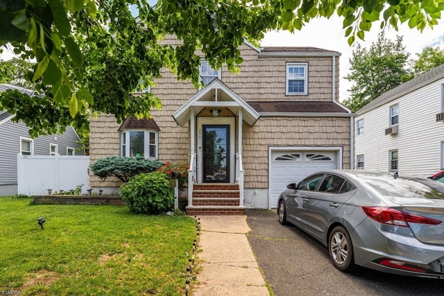 896 Maurice Ave, Rahway City, NJ 07065 - view of front facade featuring an attached garage, asphalt driveway, and cooling unit