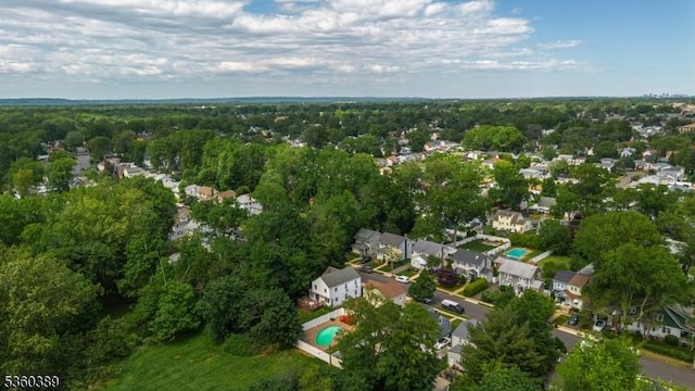 896 Maurice Ave, Rahway City, NJ 07065 - aerial view of property's location featuring a heavily wooded area, a pool area, and nearby suburban area